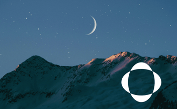 An image of starry night sky over snowy mountains. Representing the clarity and peace of knowing how to pick an asset management software