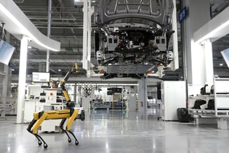 A leased inspection robot assess the production line of a automative factory